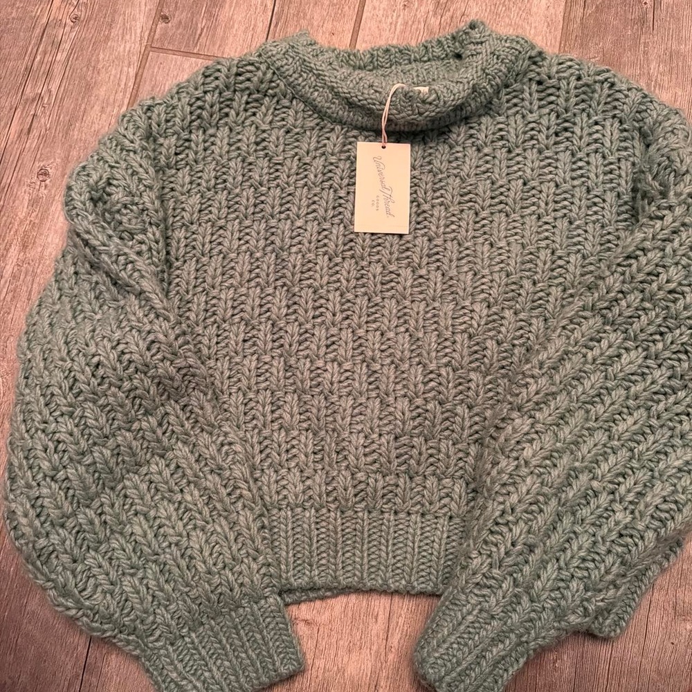 Green oversized knit sweater with leaf-like texture